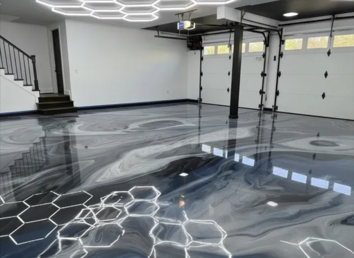 Metallic epoxy floor with mirror-like finish in a modern garage