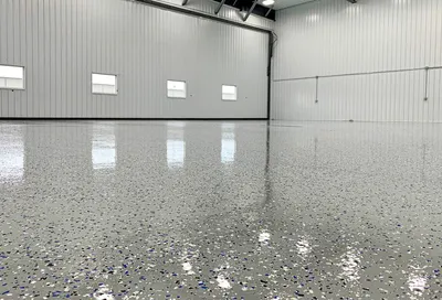 High-gloss metallic epoxy garage floor in blue finish