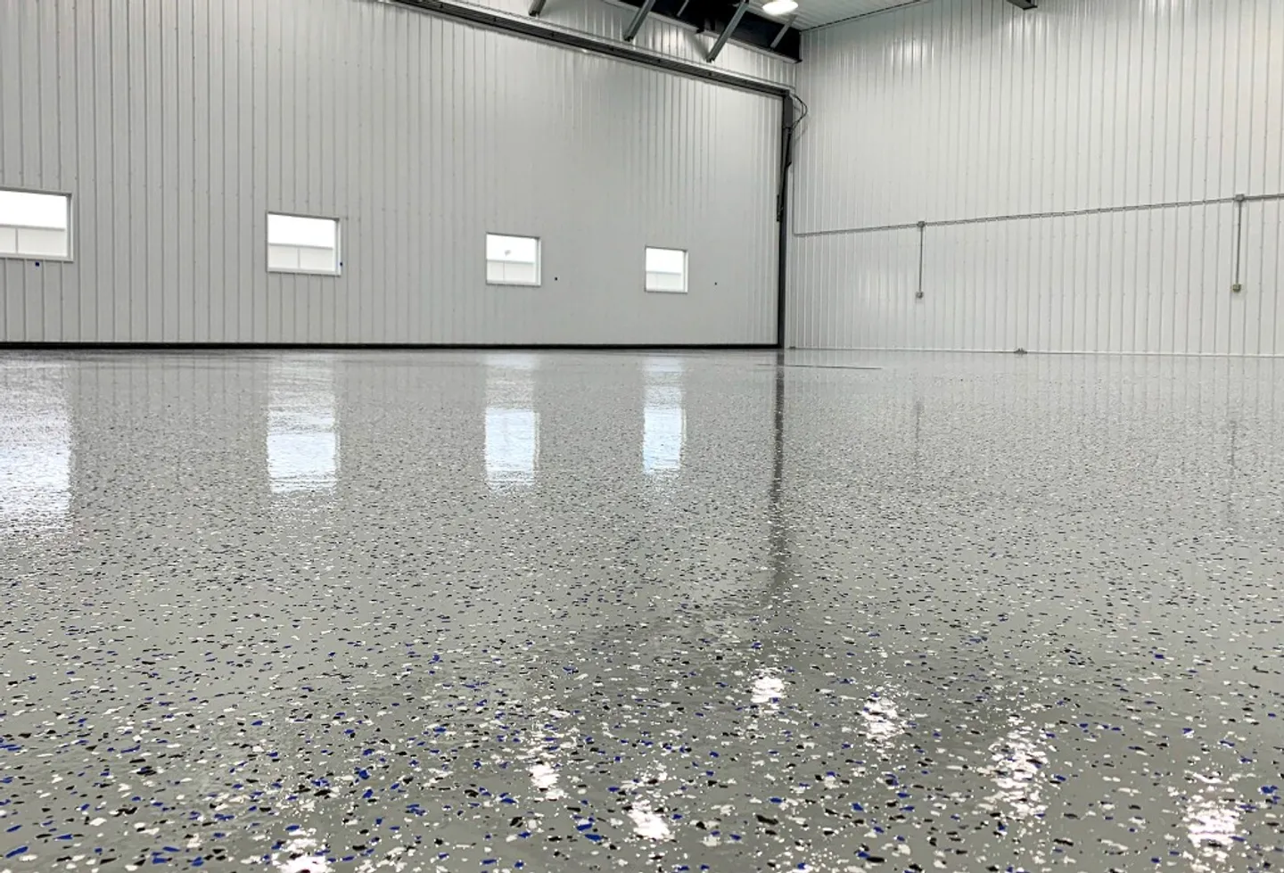 Flake epoxy floor with vinyl chips in a Central NJ garage, installed by JC Epoxy Flooring