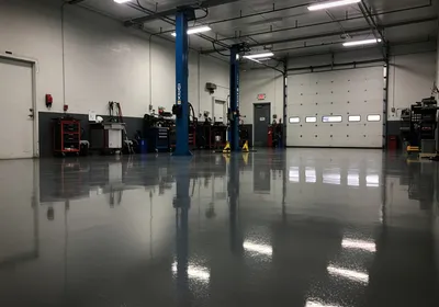 Chemical-resistant epoxy floor in a Central NJ auto repair shop and service bay